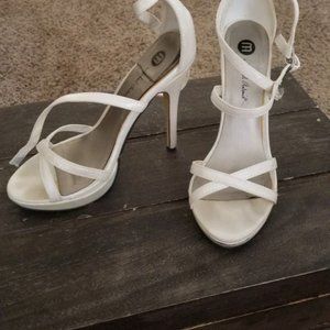 Size 6 Michael Antonio strappy heels in ivory. Great condition.